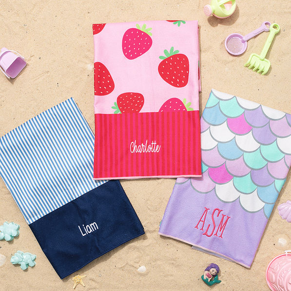 monogrammed kids beach towel in blue mini stripes mermaid and strawberries on sand