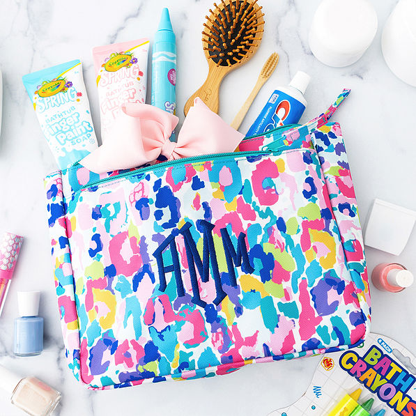 blue leopard kids toiletry bag flatlay