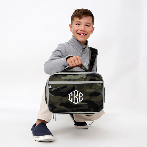 boy-with-camo-lunch-box-kneeling