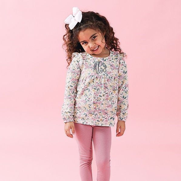 toddler in ruffle set