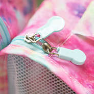 zipper detail of tie dye youth packing bag