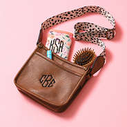 white leopard kids saddlebag flatlay