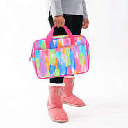 close up of girl holding multi paintbrush school laptop bag