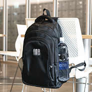 black sp25 backpack on chair