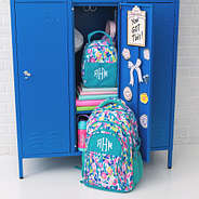 monogrammed watercolor cheetah matching lunch box and backpack in locker