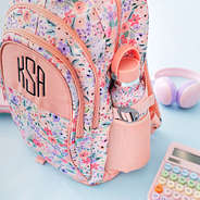 close up of personalized coral floral backpack
