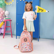 girl with pencil flag and  personalized backpack in coral floral