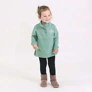 toddler in sage sweatshirt and leggings