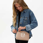 tan crossbody purse on blonde girl