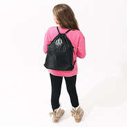 girl wearing black cinch bag