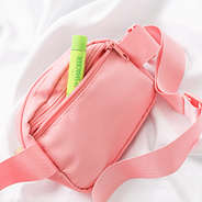 back of coral monogrammed belt bag with pocket