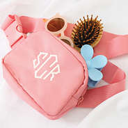 coral monogrammed kids belt bag with accessories inside