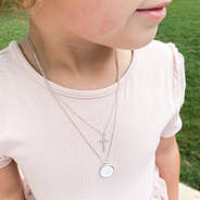 silver cross kids necklace on girl