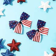 americana/flag girls hair bow set on blue backdrop