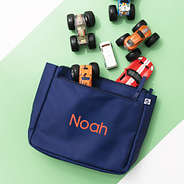 navy kids essentials pouch on green background