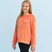 girl wearing pumpkin kids softspun sweatshirt