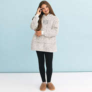 girl wearing monogrammed blanket hoodie in snow leopard