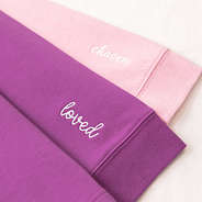 close up of loved and chosen embroidery detail on faith pullover