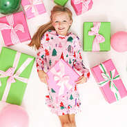 girl wearing monogrammed nightgown in pink christmas wonderland