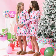 sisters wearing kids monogrammed pink wonderland christmas nightgowns