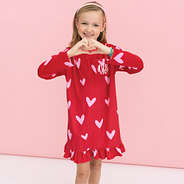 girl wearing monogrammed red hot hearts nightgown close up