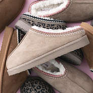 pile of kids moccasins with tanpink leopard and hickory