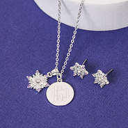 pierced girls snowflake earrings and monogrammed necklace