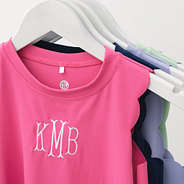 close up of personalized girls scallop dress in hot pink