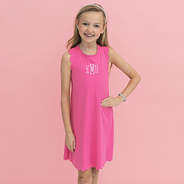 girl wearing monogrammed girls scallop dress in hot pink