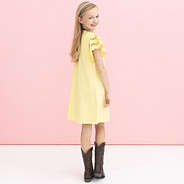 back of girl wearing soft yellow personalized girls flutter sleeve dress