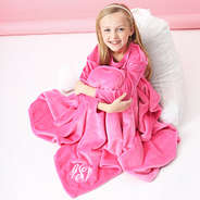 pink kids plush blanket wrapped around addie