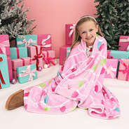 girl wearing kids plush blanket in blush and bright