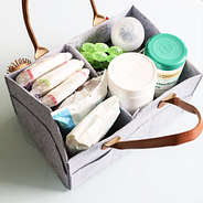 gray diaper caddy with diapers inside