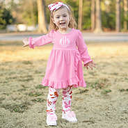 little girl wearing pink bows monogrammed ruffle legging tunic set