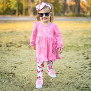 girl wearing pink bows personalized ruffle legging tunic set