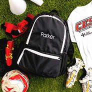 kids black activity backpack on grass