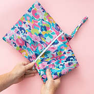 rain poncho in watercolor cheetah in storage pouch