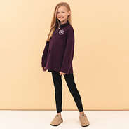 girl wearing plum monogrammed quilted pullover