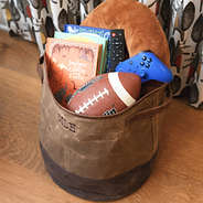 kids waxed canvas storage basket with toys and books
