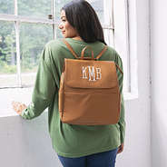 girl with monogrammed diaper backpack purse on back