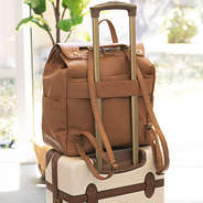 monogrammed diaper backpack purse on suitcase