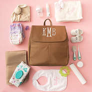 monogrammed diaper backpack purse with kids toys and accessories