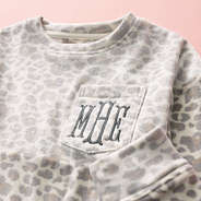 close up of kids snow leopard monogrammed pullover
