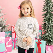 girl wearing monogrammed kids snow leopard pullover