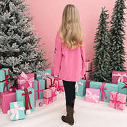 back of christmas sweatshirt in hotpink on girl