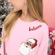 light pink christmas sweatshirt up close