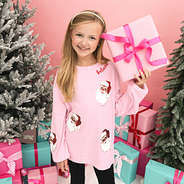 light pink christmas sweatshirt on addie