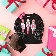 black nutcracker sweatshirt flatlay