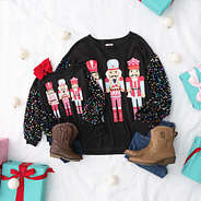 black nutcracker sweatshirt mom and me flatlay