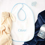 light blue outline baby bib flatlay